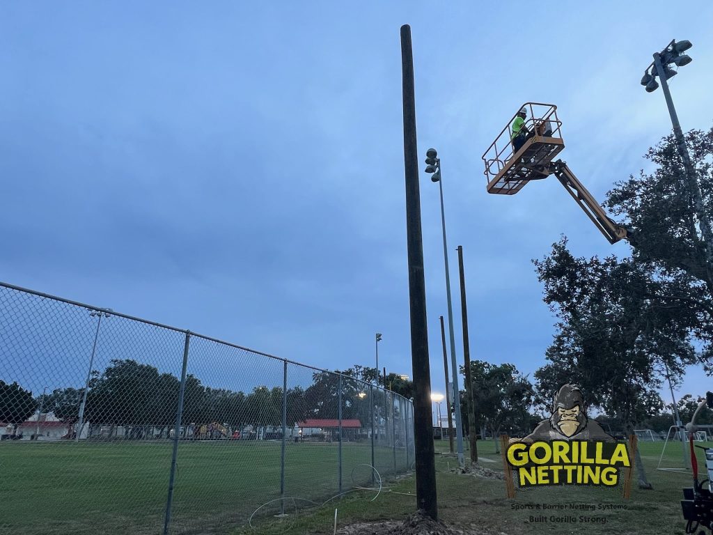 Poles being installed for a netting system.
