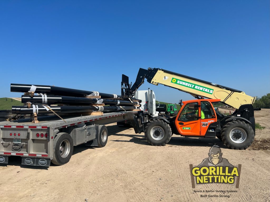 Litter Control Fence poles being delivered for a landfill.