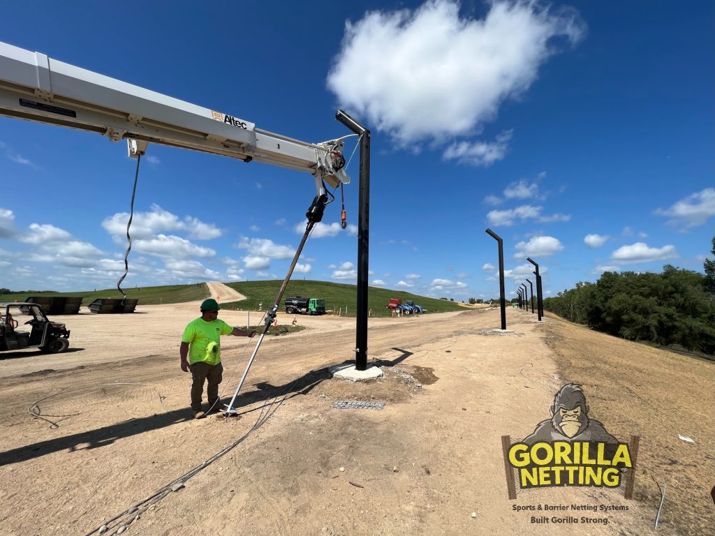 Down guy anchors being installed.