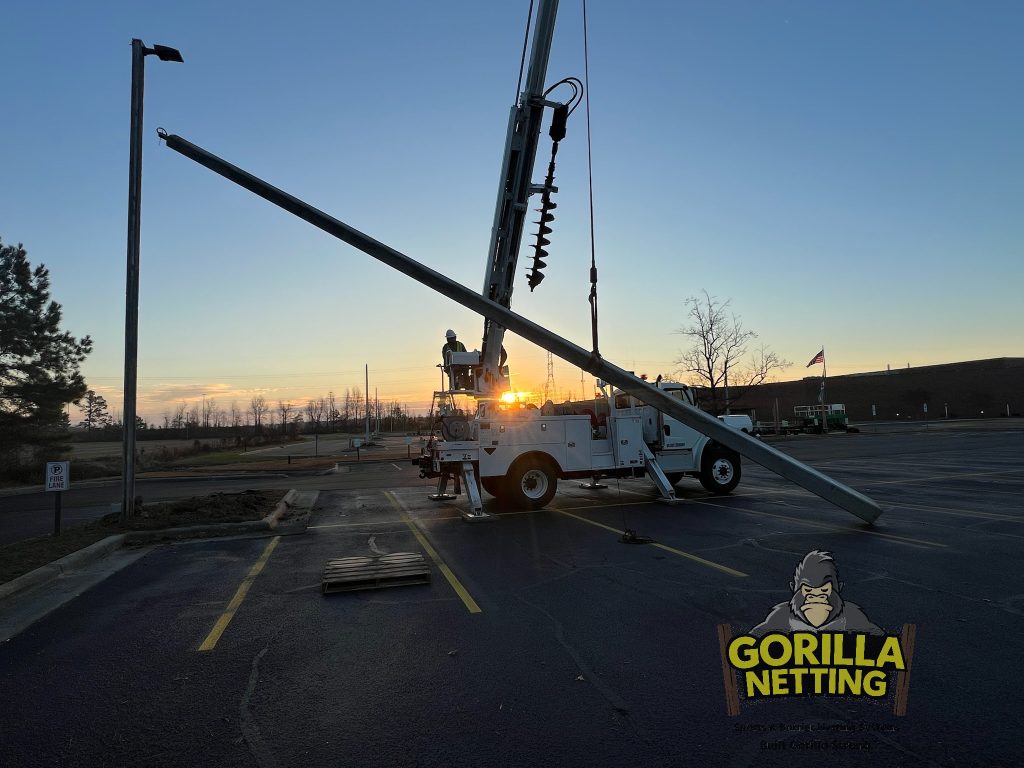 Lifting poles for parking lot lighting.