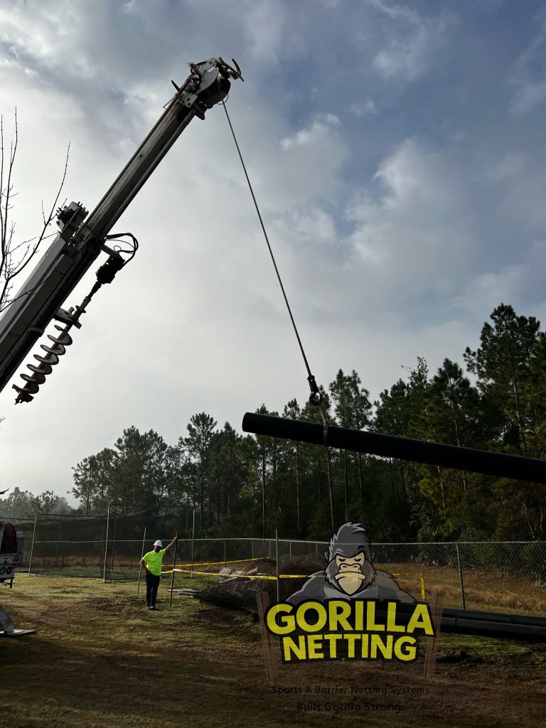 Poles being lifted to be set.