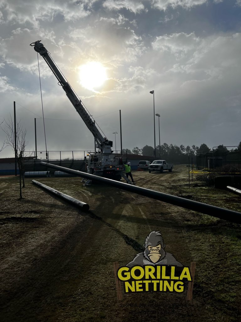 Poles being lifted to be set.