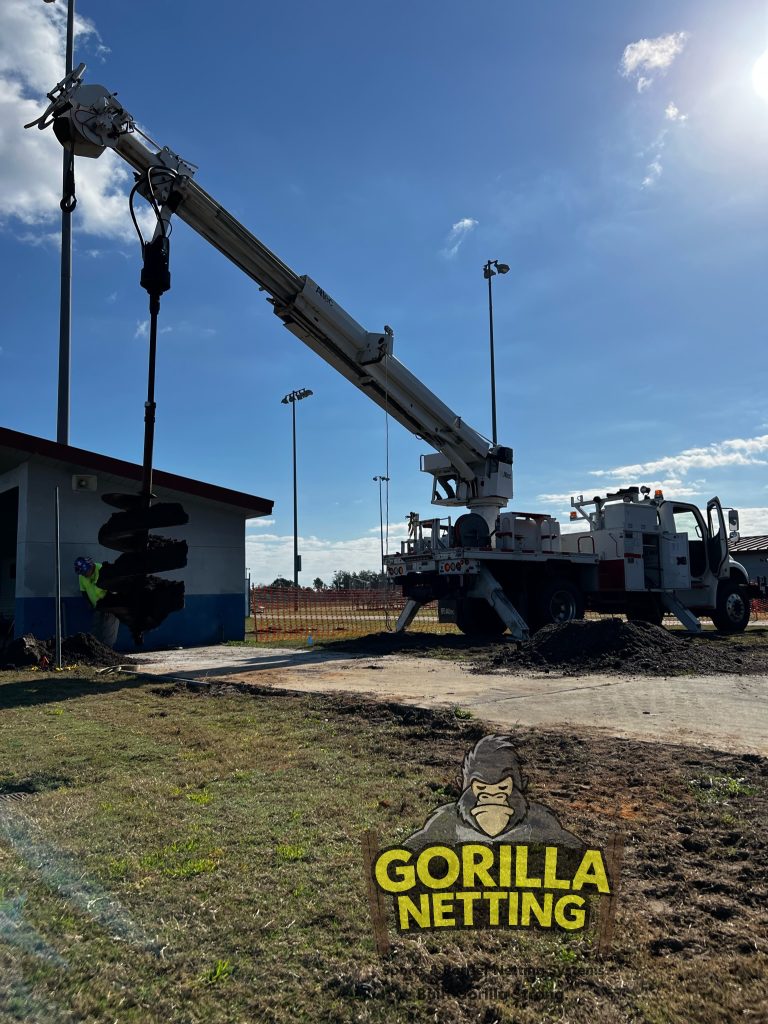 Pre-drilling for pole installation.